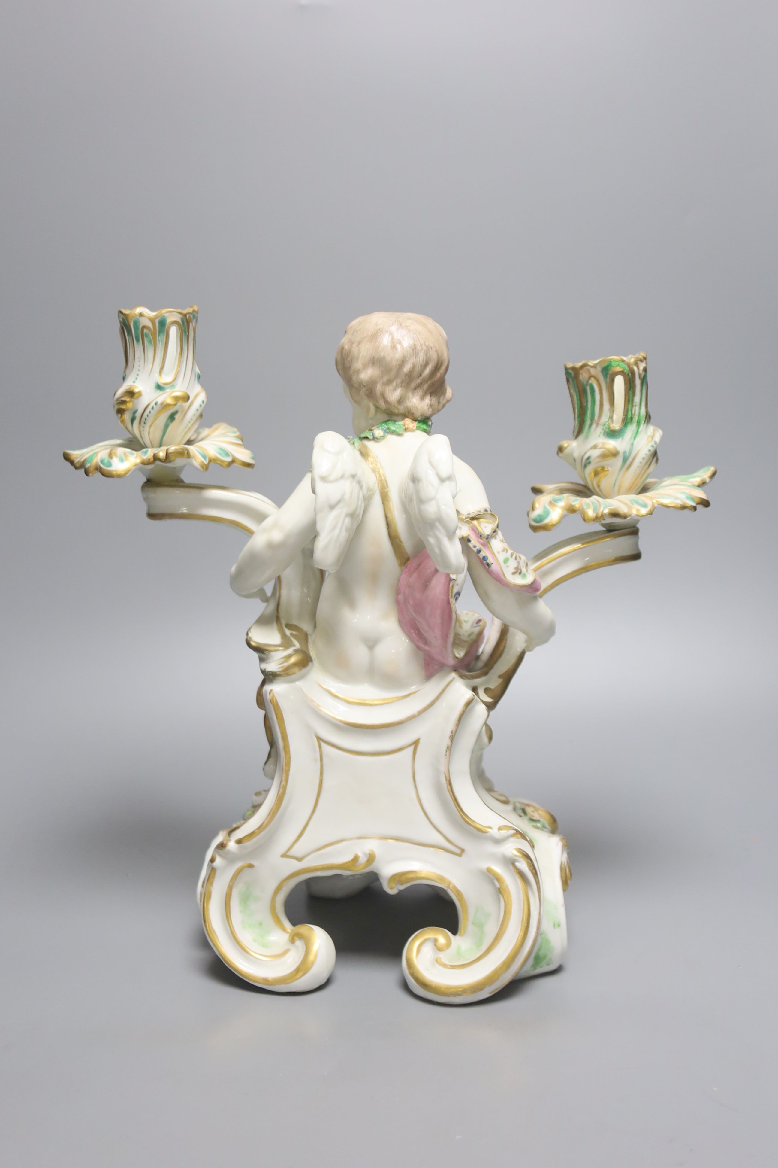 A large German porcelain 'Cupid' candelabrum, late 19th century, height 30cm